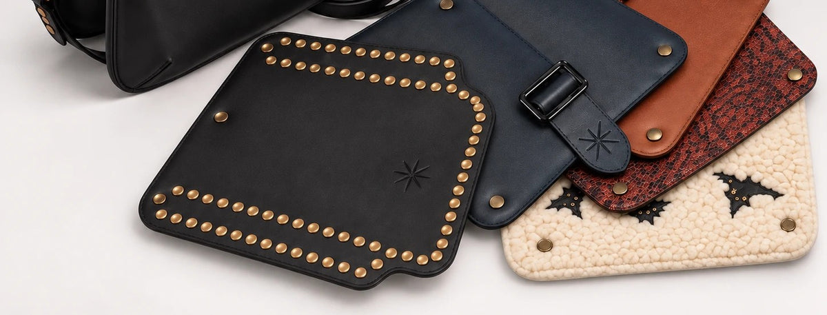 Cinq rabats Baby posés à plat en éventail — clouté noir, marine, cognac, python et bouclé crème